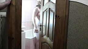 sexy blonde strips naked in bathroom roommate spies jerks off and shoots load on her wet natural tits