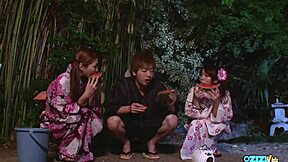 two young chicks deepthroat and suck this guy's throbbing cock passionately