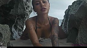 Skinny asian babe fingers pussy on crowded public beach