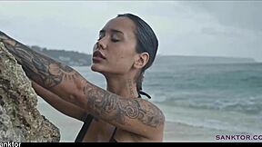 Skinny asian babe fingers pussy on crowded public beach