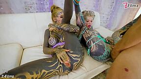 Tattooed teen takes threesome facial after gaping anal orgy ride