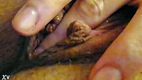 Rough clit rubbing makes her pussy drip