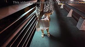 😏 luscious milf struts bra-less panty-free over the bridge, flashing those huge tits! 🔥