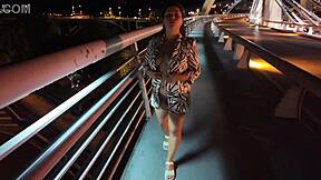 😏 luscious milf struts bra-less panty-free over the bridge, flashing those huge tits! 🔥