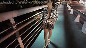 😏 luscious milf struts bra-less panty-free over the bridge, flashing those huge tits! 🔥