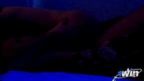 A young brunette rides her muscular lover's big cock during a sensual home session with soft music playing in the background.