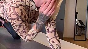 sophie van loo heats kitchen counter in gray leggings high heels