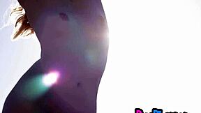 Petite blonde Emmi Wild strips lingerie posing to expose small tits pussy