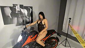 mia montielth relaxes privately on her shiny new motorcycle alone