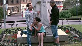 Cute teen poses with statue in group play