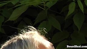 blonde slave bound in garage chains gets whipped hard by mistress