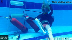 Check out horny Ashlee Rose in her slutty dress scuba diving underwater.
