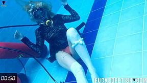 Check out horny Ashlee Rose in her slutty dress scuba diving underwater.