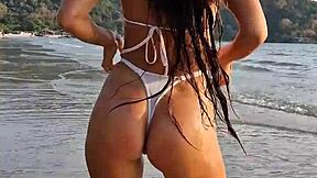 flashing my sexy white bikini on the beach today