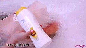 gorgeous brunette relaxes in a steamy bath during casting photoshoot