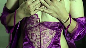 she slips her curves into a white satin dress before masturbating wildly alone