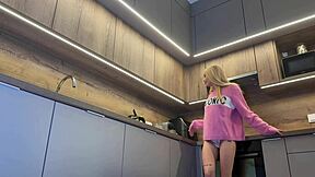 hot petite skinny blonde girlfriend teases in kitchen pink pullover