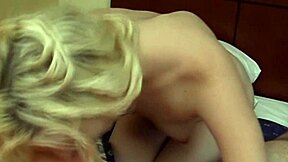 Young blonde babe strips lingerie bares huge tits in nude solo tease