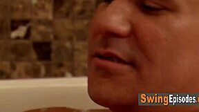 Amateur swinger couple steams up hot tub with sensual kisses