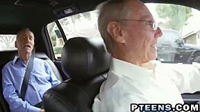 WOW! redhead teen sucks off two old cocks sideways!