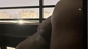 Damn, sexy brunette's balcony deepthroat blowjob has me drooling—watch her swallow!