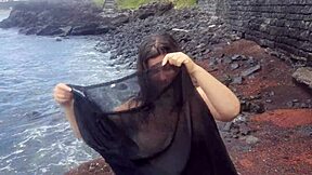 curvy brunette flashes big tits pussy beach photoshoot tease