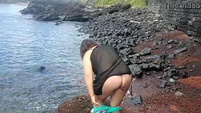 curvy brunette flashes big tits pussy beach photoshoot tease