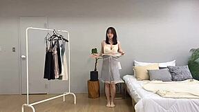 Korean babe spends sexy day swapping clothes in her room