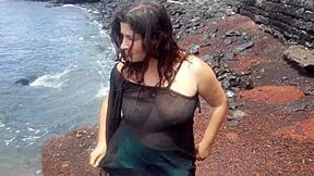 curvy brunette flashes big tits pussy beach photoshoot tease