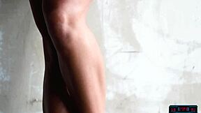 Madison Walker stretches her big natural tits in morning routine on concrete.