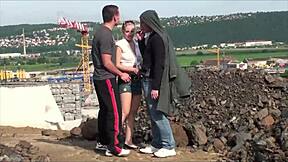 cute blonde teen does public threesome blowbang at construction site