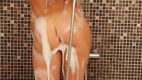 Tanned coed anjelica seduces in foamy bathtub stripping wet small tits