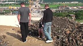 cute blonde teen does public threesome blowbang at construction site