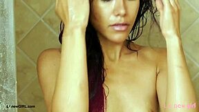 elegant brunette steps into steamy shower, soaping her curves slowly