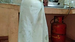 maid auntie fingers carrot in kitchen secretly