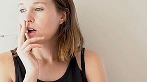 that hot petite brunette with blue eyes smokes and teases like a voyeur dream.