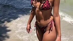 Cute ebony teen bares her pussy outdoors!