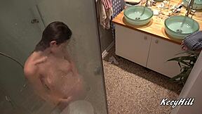 Hey, check out busty Kecy stripping naked in the shower, damn those natural tits sway so sexy!