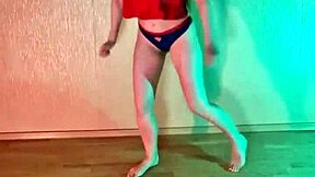 Studying hip hop dance moves in panties barefoot.