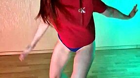 Studying hip hop dance moves in panties barefoot.