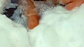 a young argentinian babe fingers herself to orgasm in the bathtub