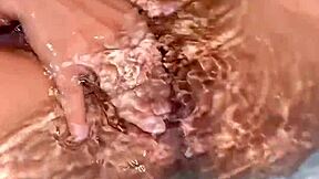 a young argentinian babe fingers herself to orgasm in the bathtub