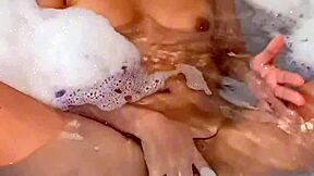 a young argentinian babe fingers herself to orgasm in the bathtub