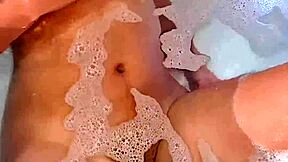 a young argentinian babe fingers herself to orgasm in the bathtub