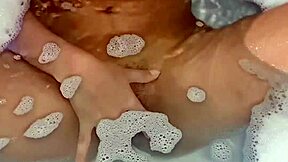 a young argentinian babe fingers herself to orgasm in the bathtub
