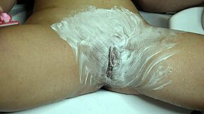 Close-Up Shaving of Hairy Teen Pussy with Foam in Bathroom
