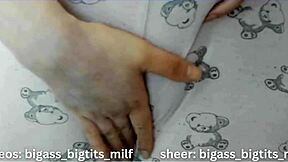 She teases her cameltoe through tight pajamas.