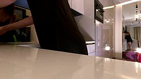 hey, check this long-legged brunette wife teasing satin fishnets in kitchen