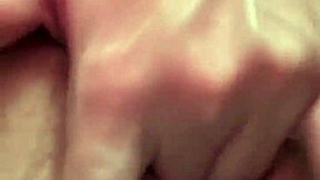 pretty blonde babe fingers shaved pussy close-up on bed panties aside