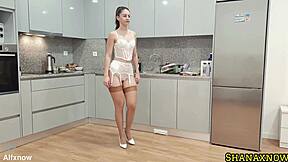 vintage nerd in white lingerie parades stockings high heels